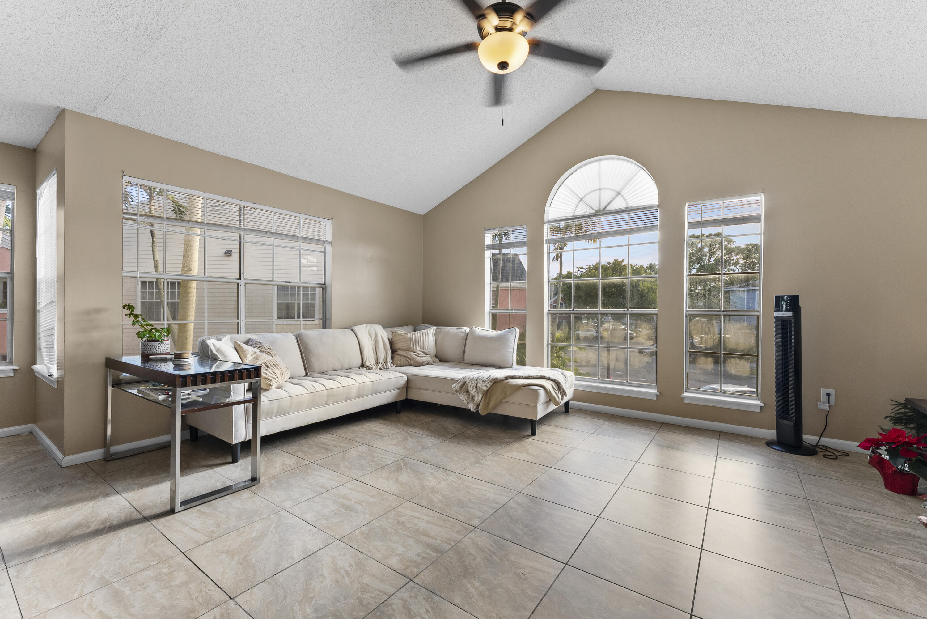 1365 Crystal Way, Unit H Delray Beach, FL 33444 - Photo 3 of 34 a living room with furniture and a large window