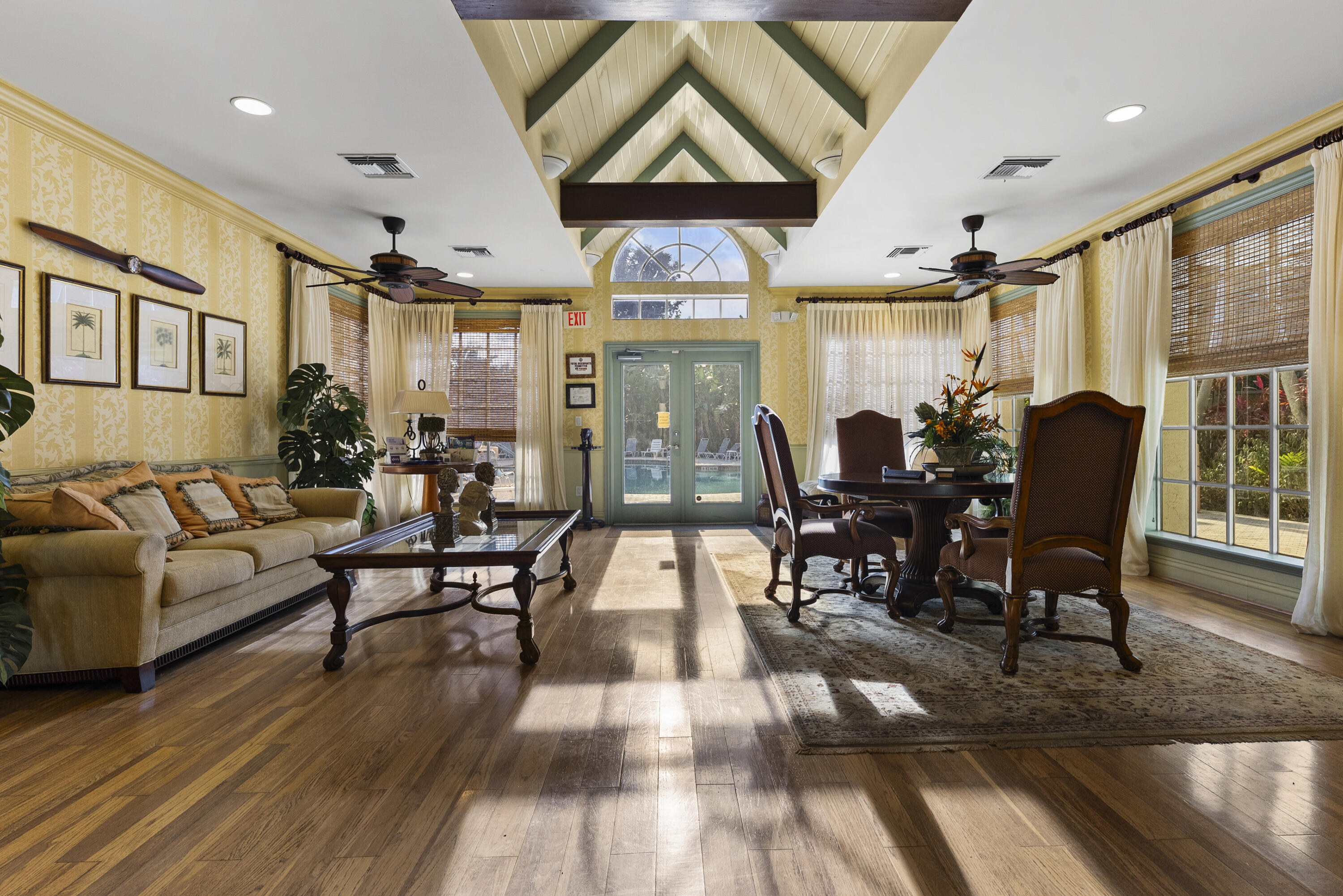 1365 Crystal Way, Unit H Delray Beach, FL 33444 - Photo 7 of 34 a living room with furniture dining table and a large window