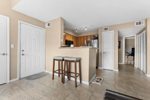 a view of a livingroom with furniture and front door