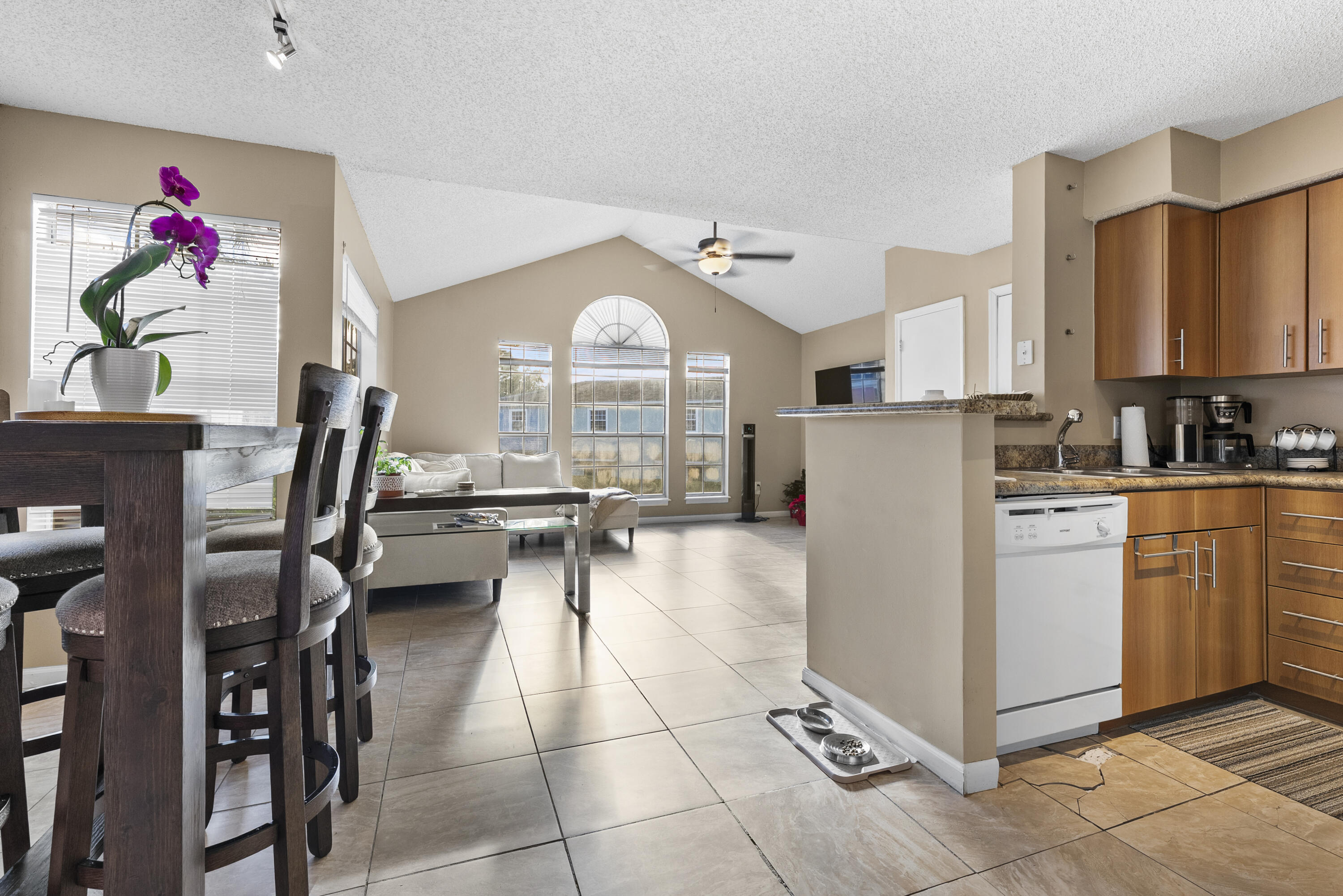 1365 Crystal Way, Unit H Delray Beach, FL 33444 - Photo 9 of 34 a kitchen with cabinets and appliances