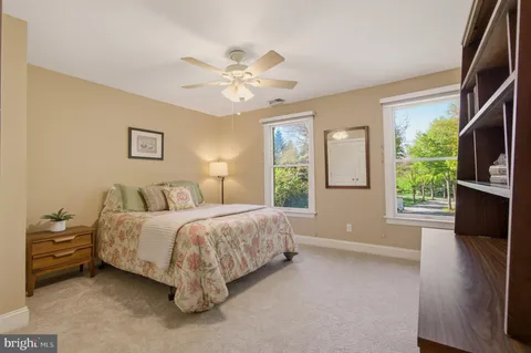 a bed room with a bed and a window