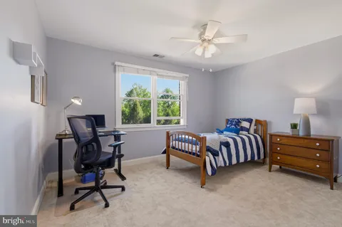 a bed room with furniture and a window