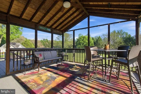 a view of a patio with a table chairs and a table