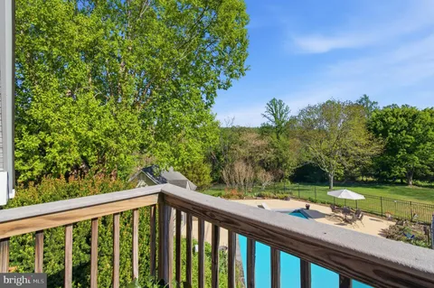 a view of balcony and yard