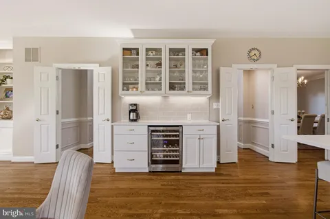 a view of an empty room with closet and a window