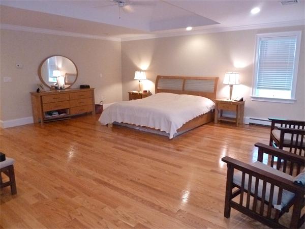 80 Richard Road Needham, MA 02492 - Photo 15 of 30 a spacious bedroom with a bed window and dresser