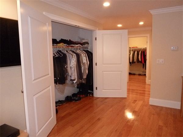80 Richard Road Needham, MA 02492 - Photo 17 of 30 a view of walk in closet with clothes and shoes