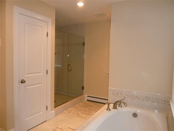 80 Richard Road Needham, MA 02492 - Photo 20 of 30 a bathroom with a tub and shower