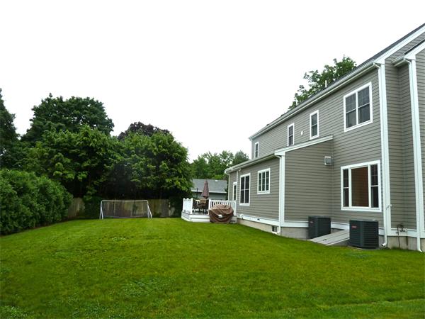 80 Richard Road Needham, MA 02492 - Photo 2 of 30 a backyard of a house with table and chairs