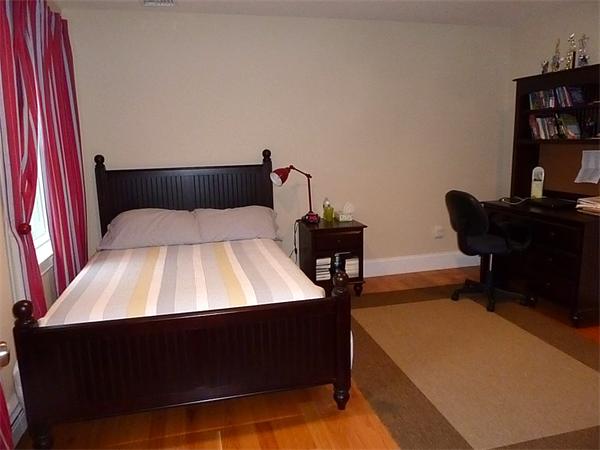 80 Richard Road Needham, MA 02492 - Photo 23 of 30 a bedroom with a bed and a bookshelf