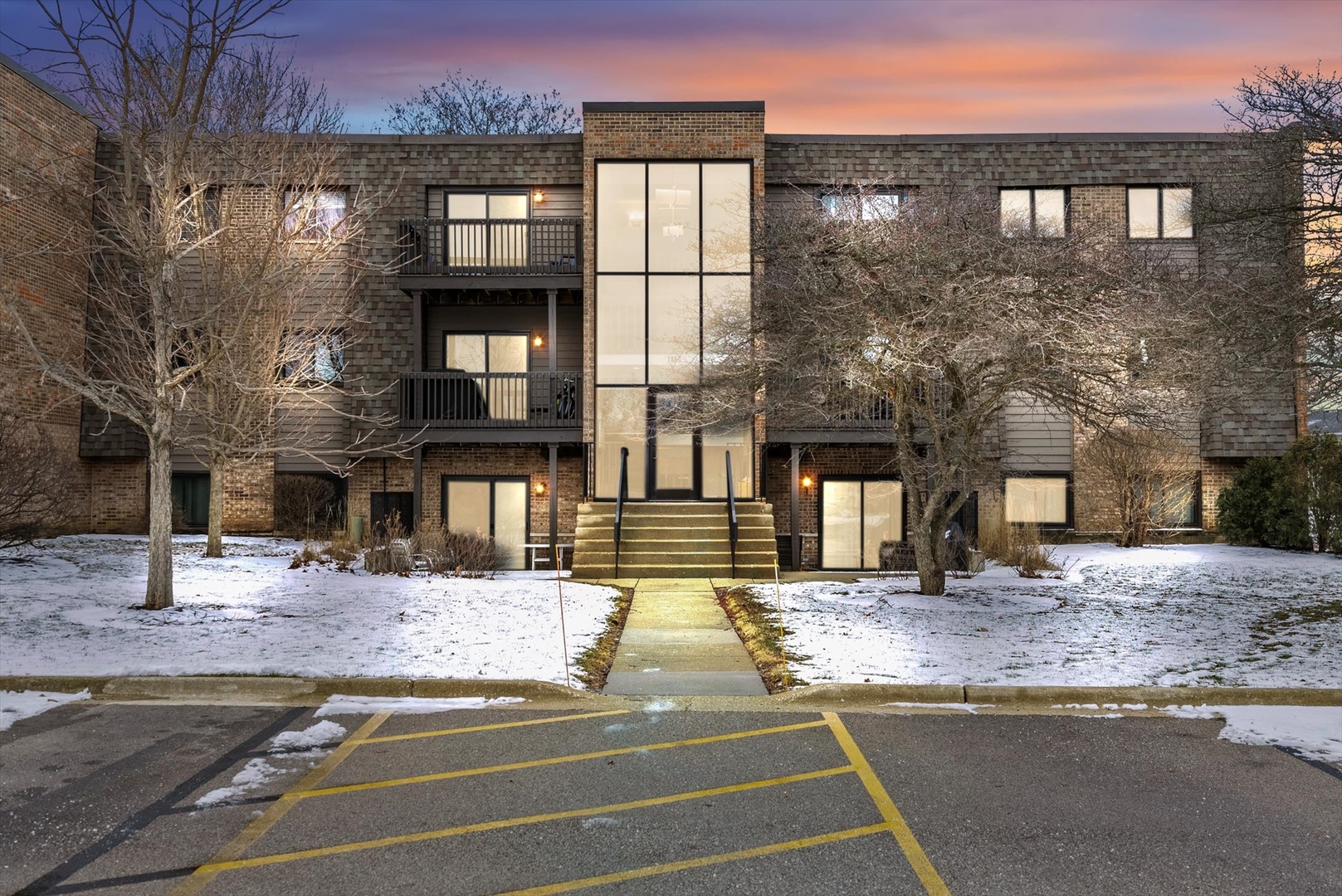 1426 Stonebridge Circle, Unit K8 Wheaton, IL 60189 - Photo 1 of 20 a view of a building with a street