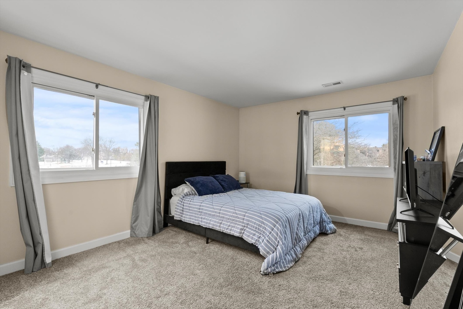 1426 Stonebridge Circle, Unit K8 Wheaton, IL 60189 - Photo 13 of 20 a bedroom with a bed tv and window