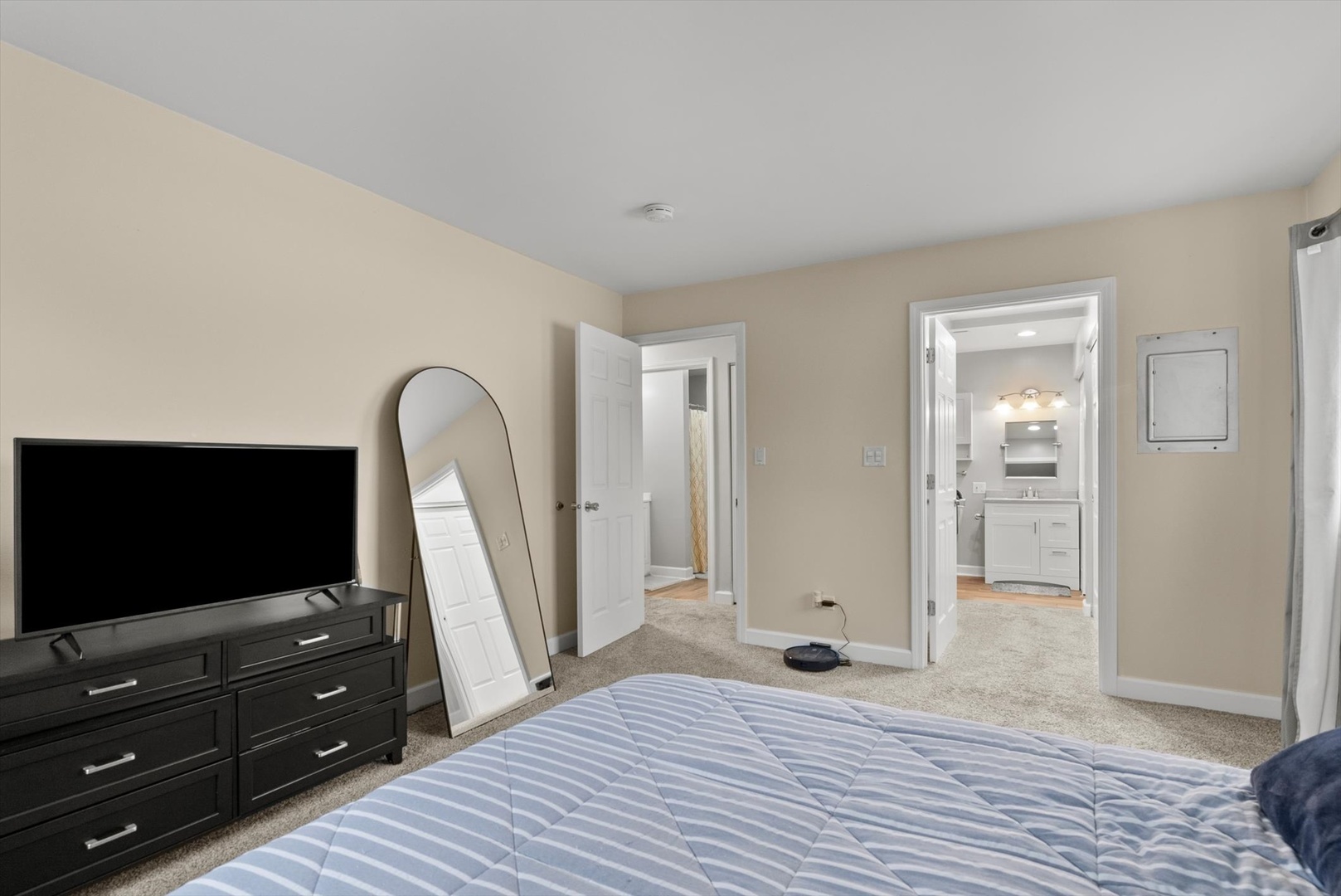 1426 Stonebridge Circle, Unit K8 Wheaton, IL 60189 - Photo 14 of 20 a bedroom with a bed and a flat screen tv