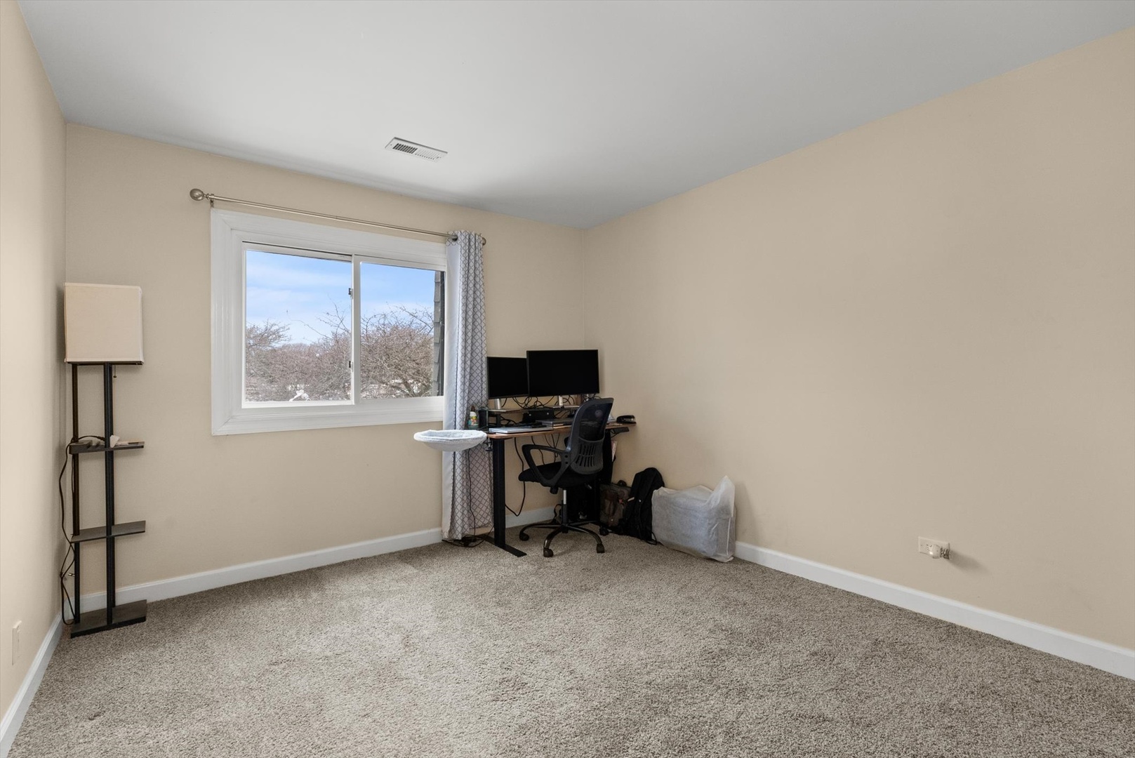 1426 Stonebridge Circle, Unit K8 Wheaton, IL 60189 - Photo 15 of 20 a view of a workspace with furniture and a window
