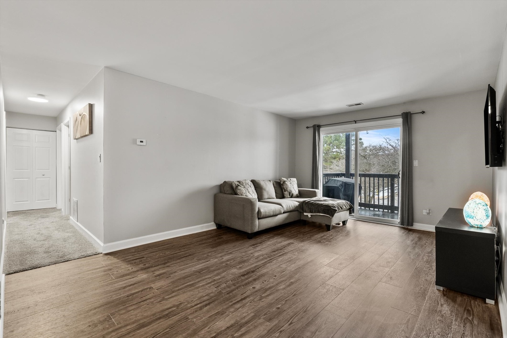 1426 Stonebridge Circle, Unit K8 Wheaton, IL 60189 - Photo 5 of 20 a living room with furniture and a wooden floor