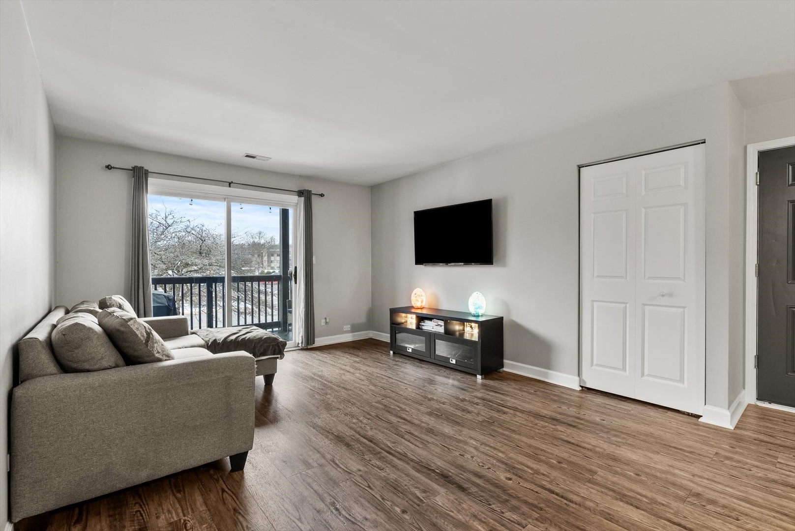 1426 Stonebridge Circle, Unit K8 Wheaton, IL 60189 - Photo 6 of 20 a living room with furniture and a flat screen tv