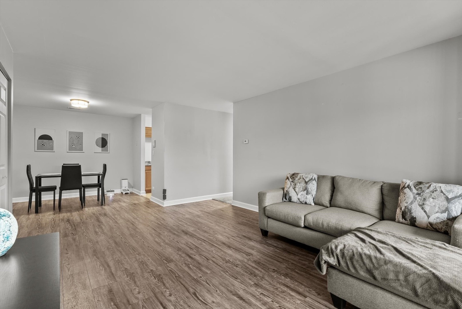 1426 Stonebridge Circle, Unit K8 Wheaton, IL 60189 - Photo 7 of 20 a living room with furniture and a couch
