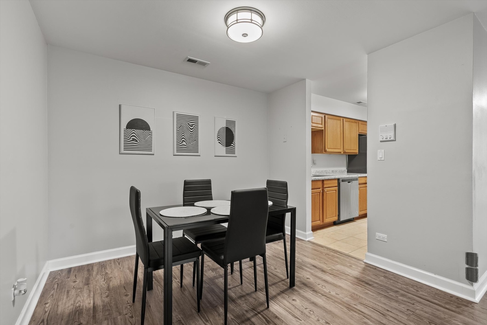 1426 Stonebridge Circle, Unit K8 Wheaton, IL 60189 - Photo 8 of 20 a view of a dining room with furniture and wooden floor
