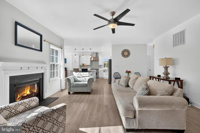 a living room with furniture a fireplace