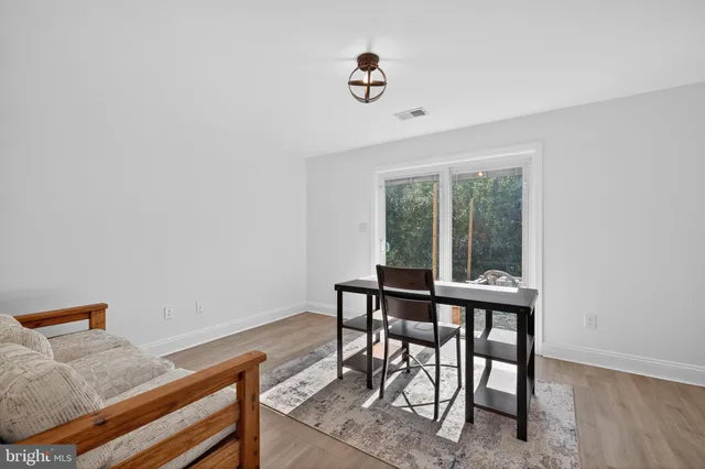 a view of a workspace with furniture