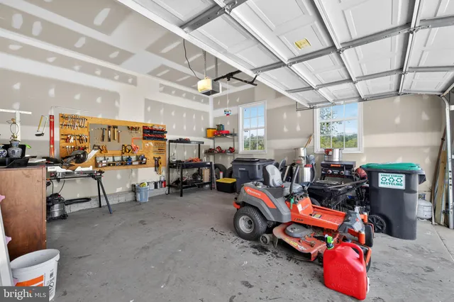 a view of a white house with a swimming pool