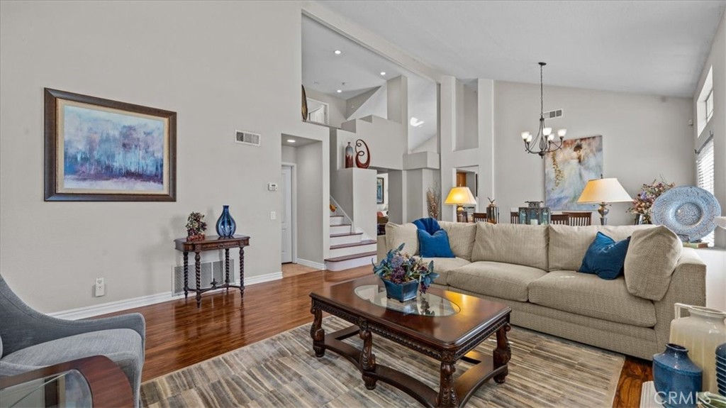 1671 Dominguez Ranch Road Corona, CA 92878 - Photo 9 of 42 This open-concept living space connects effortlessly to the dining area and entryway, highlighted by high ceilings and natural light throughout.