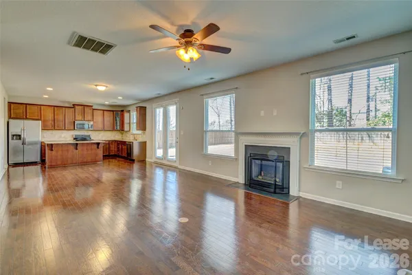a view of a livingroom with furniture a fireplace