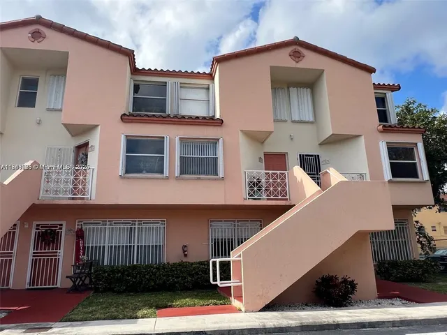 a front view of a house with garage