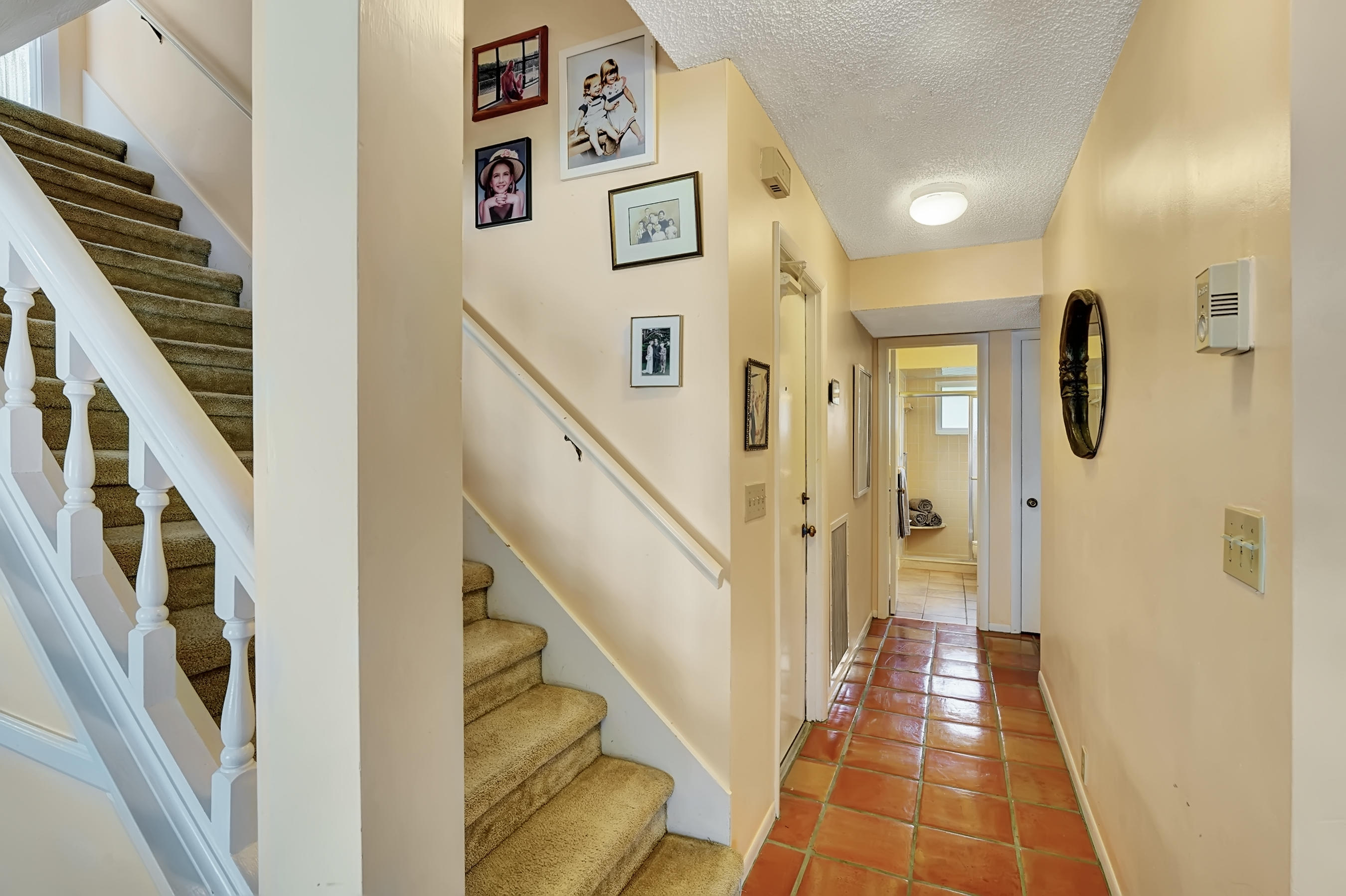 16 Sailfish Lane Ocean Ridge, FL 33435 - Photo 16 of 37 a view of a hallway with windows and stairs