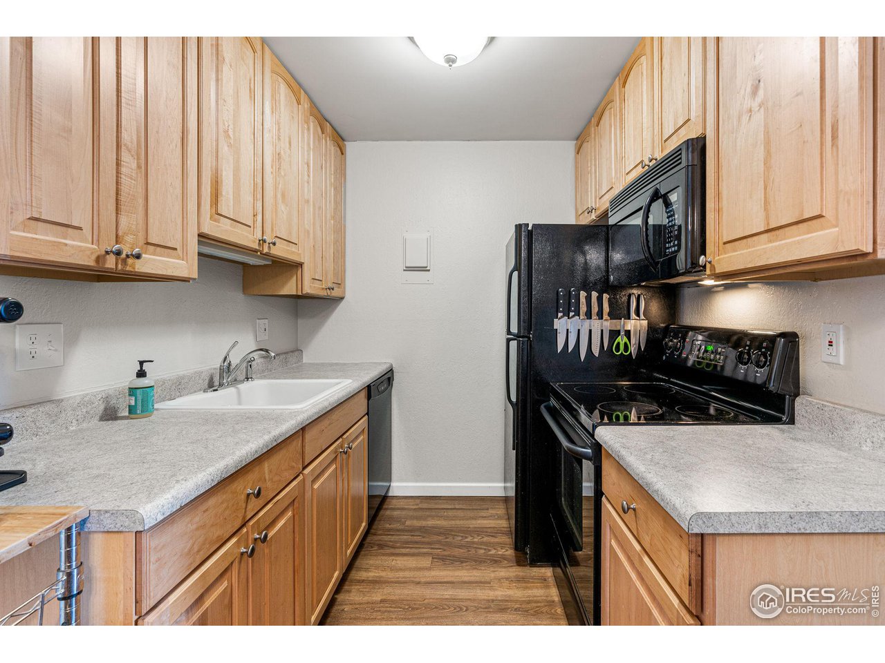 3250 Oneal Circle, Unit 23 Boulder, CO 80301 - Photo 7 of 27 a kitchen with stainless steel appliances granite countertop a sink stove and cabinets