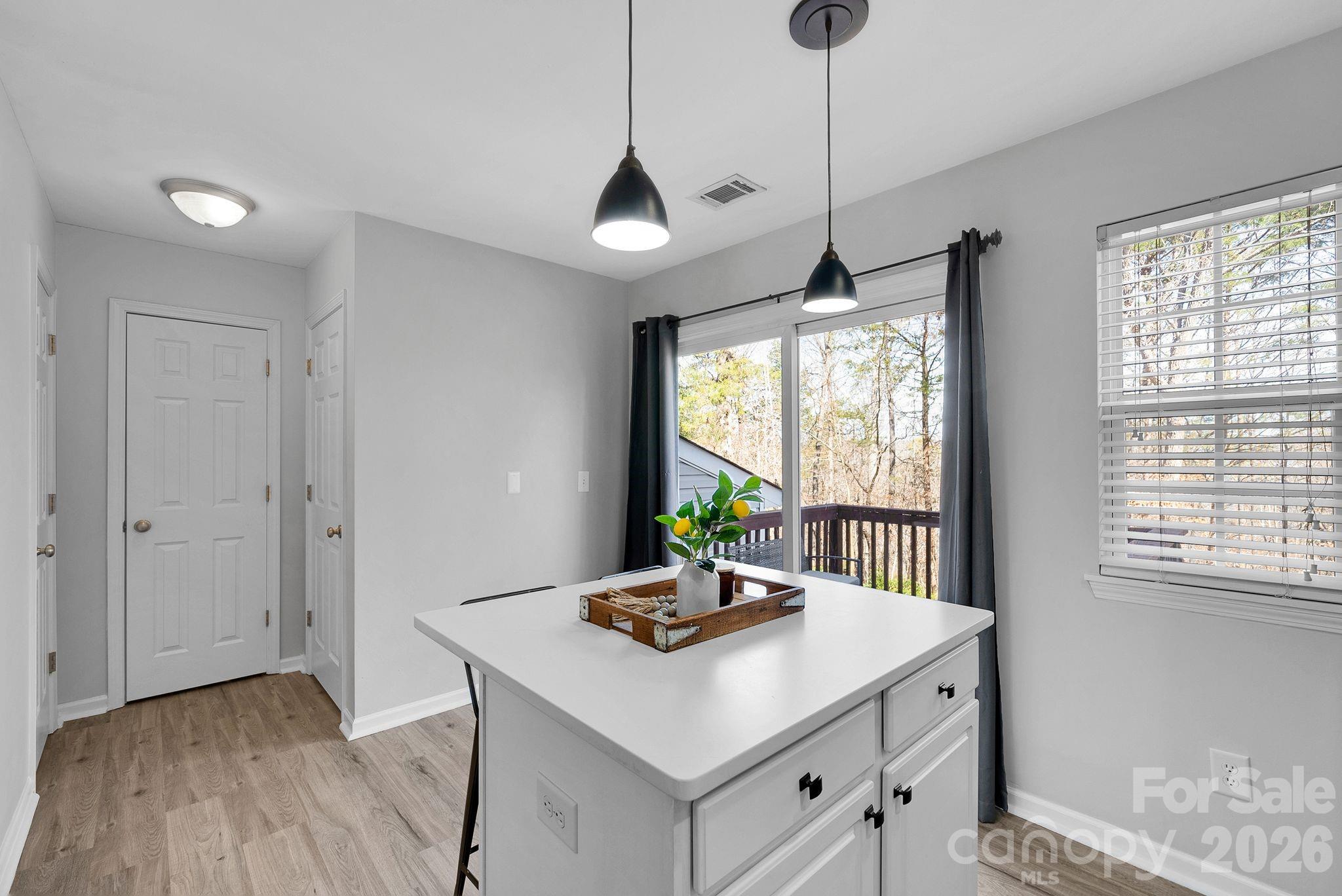 1570 Maypine Commons Way Rock Hill, SC 29732 - Photo 11 of 23 a view of a kitchen with a sink a window and wooden floor