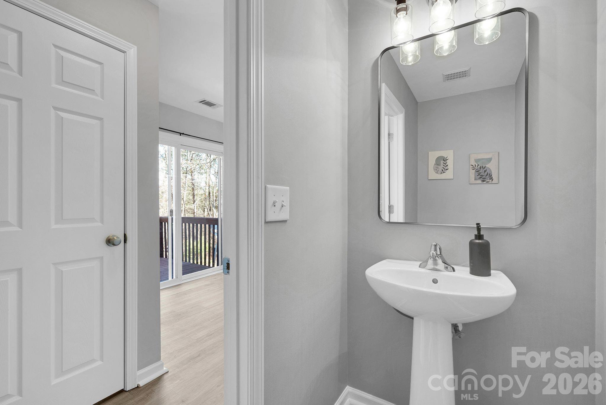 1570 Maypine Commons Way Rock Hill, SC 29732 - Photo 12 of 23 a bathroom with a sink and a mirror