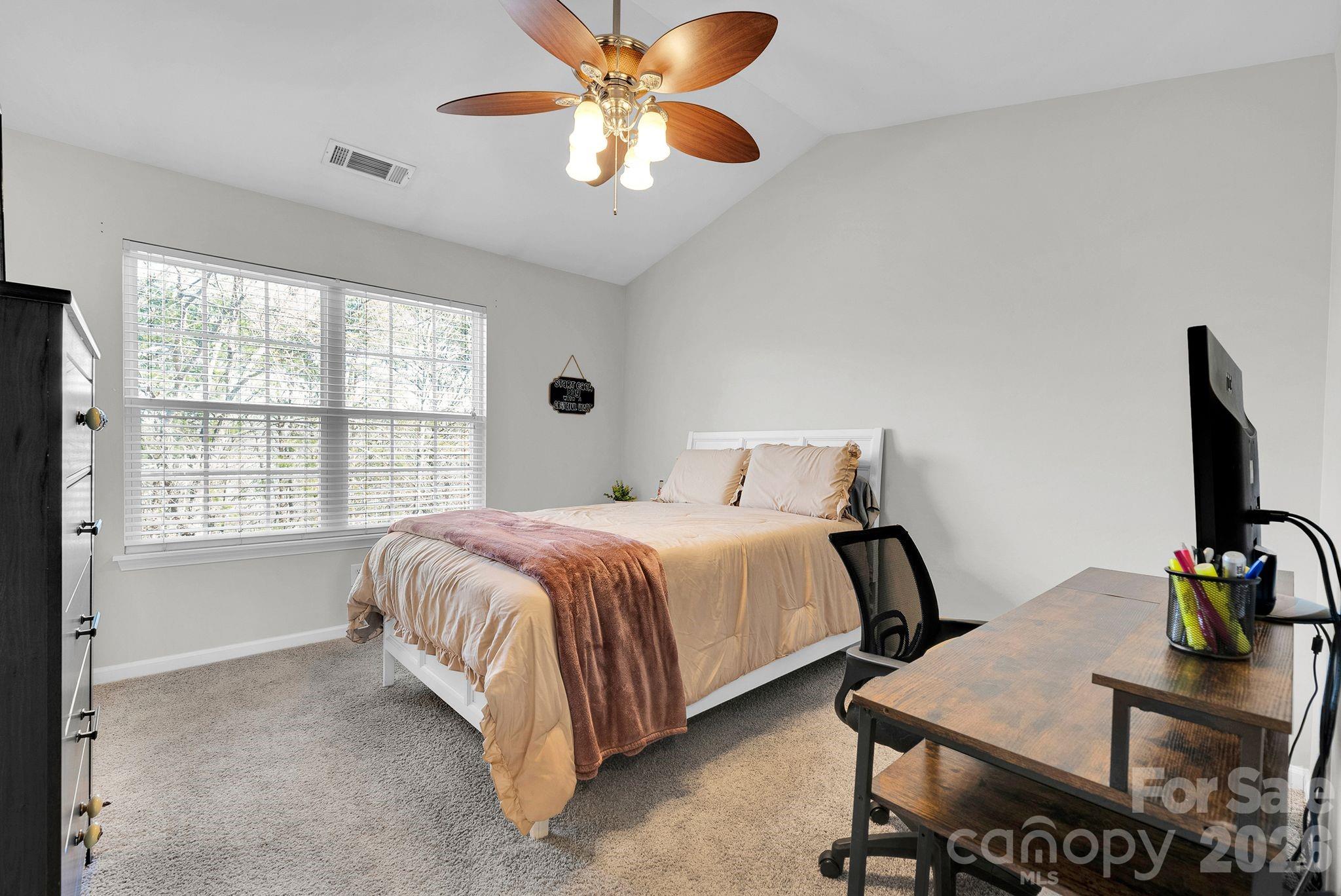 1570 Maypine Commons Way Rock Hill, SC 29732 - Photo 17 of 23 a spacious bedroom with a bed and a large window