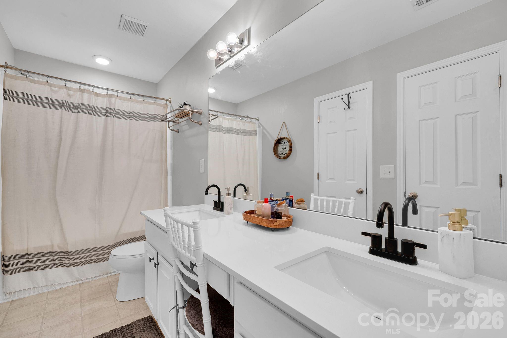 1570 Maypine Commons Way Rock Hill, SC 29732 - Photo 18 of 23 a kitchen with a sink and cabinets