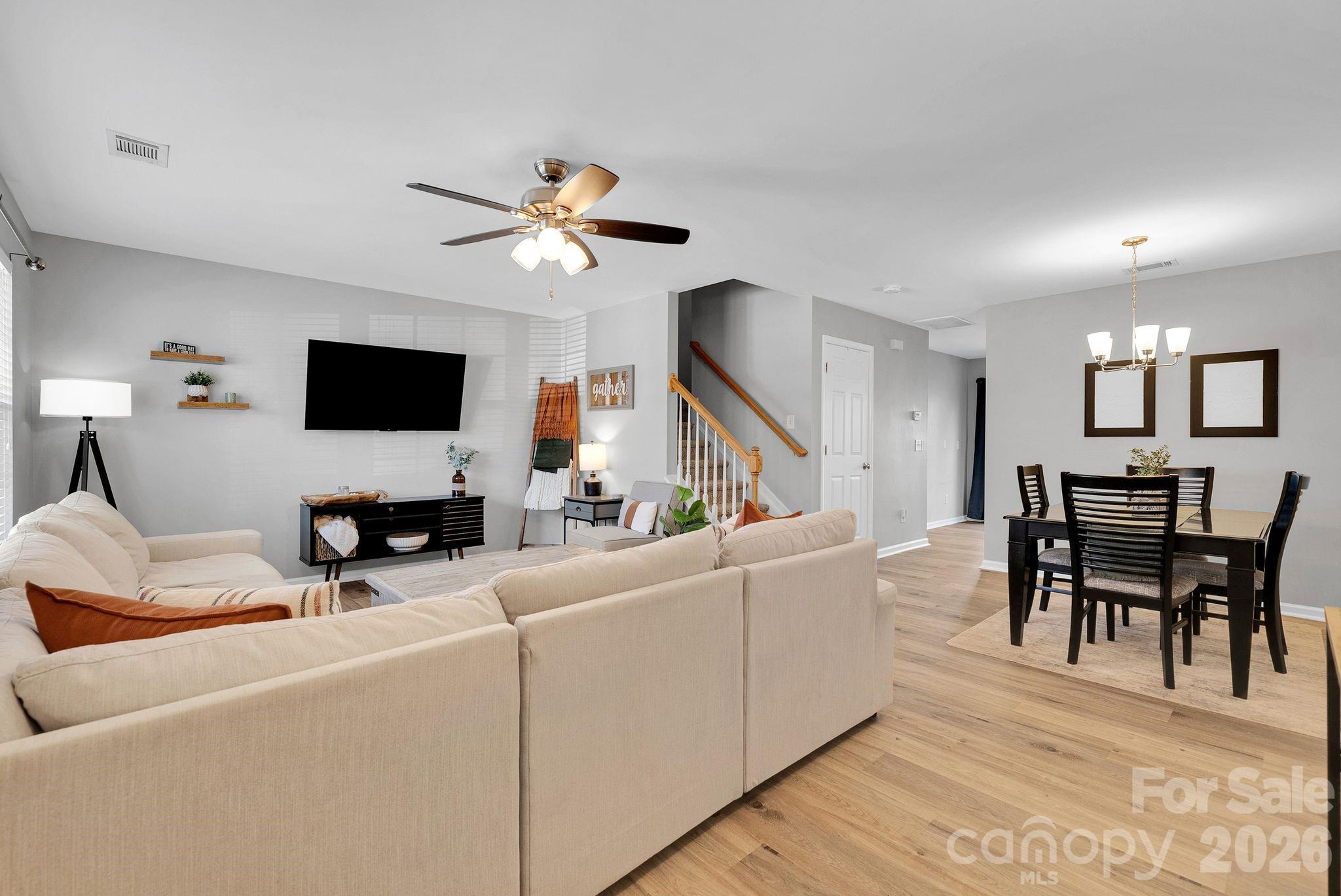 1570 Maypine Commons Way Rock Hill, SC 29732 - Photo 5 of 23 a living room with furniture a dining table and a fireplace
