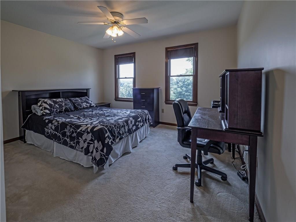 7003 Eagle Road Gibsonia, PA 15044 - Photo 17 of 25 The guest bedroom features neutral decor and bright windows.