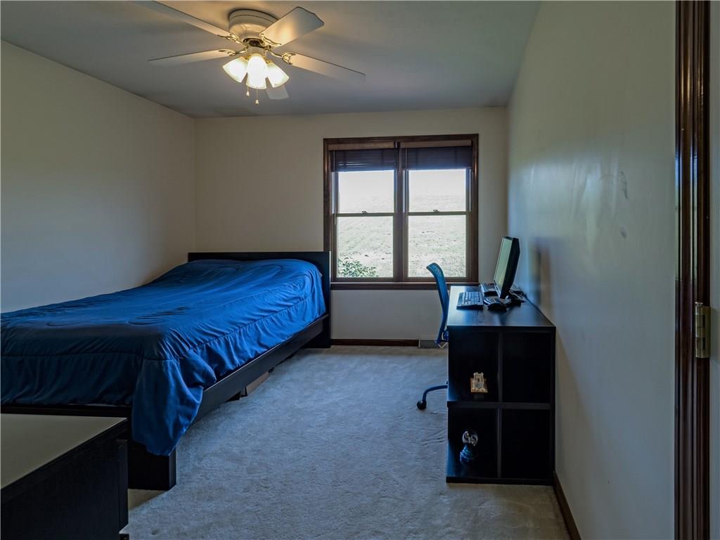7003 Eagle Road Gibsonia, PA 15044 - Photo 20 of 25 A third guest bedroom is neutral and bright with plenty of space for furniture.