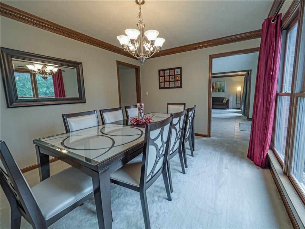7003 Eagle Road Gibsonia, PA 15044 - Photo 4 of 25 The formal dining room features large, bright windows, neutral decor and crown molding.