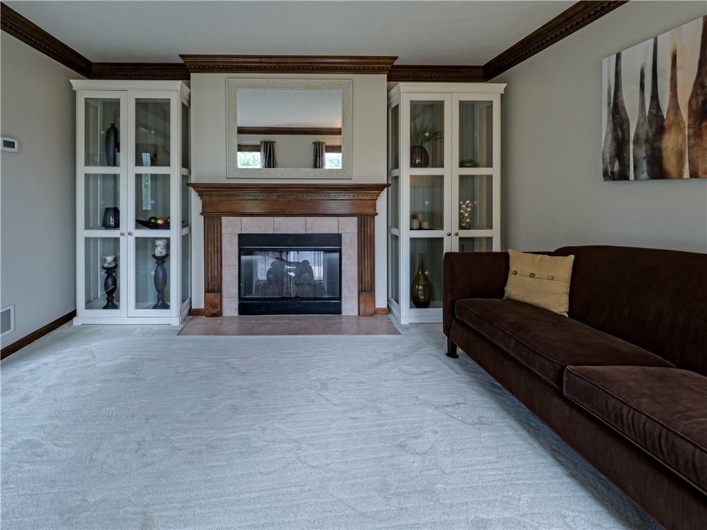 7003 Eagle Road Gibsonia, PA 15044 - Photo 6 of 25 The formal living room also features plush carpet and a gas fireplace.