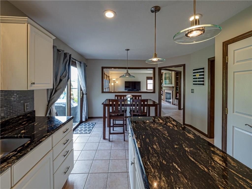 7003 Eagle Road Gibsonia, PA 15044 - Photo 9 of 25 A casual dining space features access to the back patio and yard.