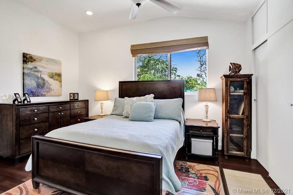 1301 South Biscayne Point Road Miami Beach, FL 33141 - Photo 15 of 45 a bedroom with a bed and a dresser