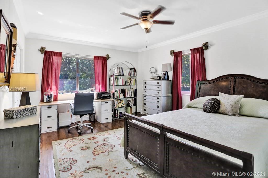 1301 South Biscayne Point Road Miami Beach, FL 33141 - Photo 18 of 45 a bedroom with a bed and a desk