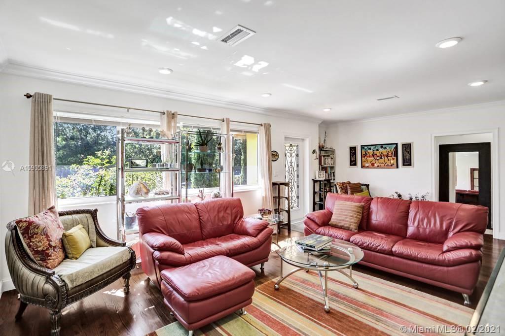 1301 South Biscayne Point Road Miami Beach, FL 33141 - Photo 3 of 45 a living room with furniture and a large window
