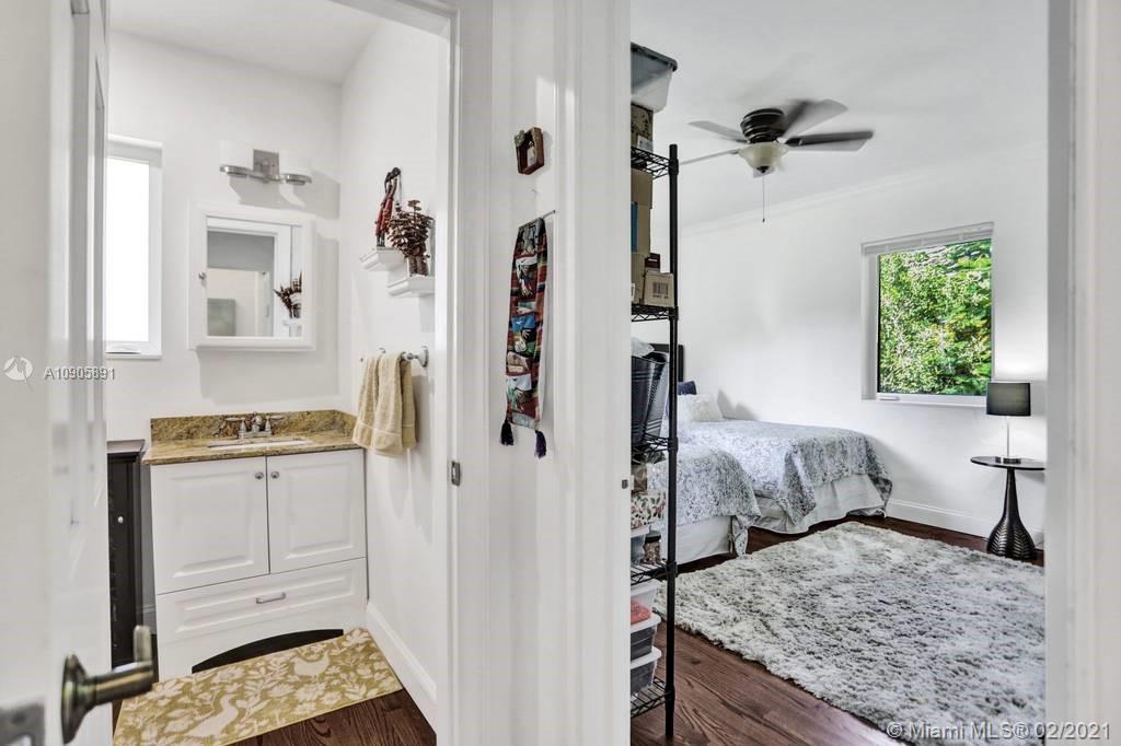 1301 South Biscayne Point Road Miami Beach, FL 33141 - Photo 21 of 45 a bedroom with a bed and a dresser