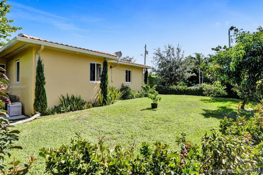 1301 South Biscayne Point Road Miami Beach, FL 33141 - Photo 29 of 45 a view of a house with a backyard