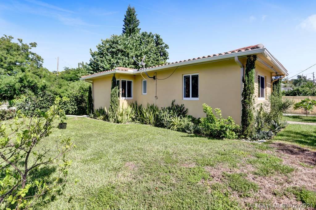 1301 South Biscayne Point Road Miami Beach, FL 33141 - Photo 30 of 45 a view of a house with a yard and plants