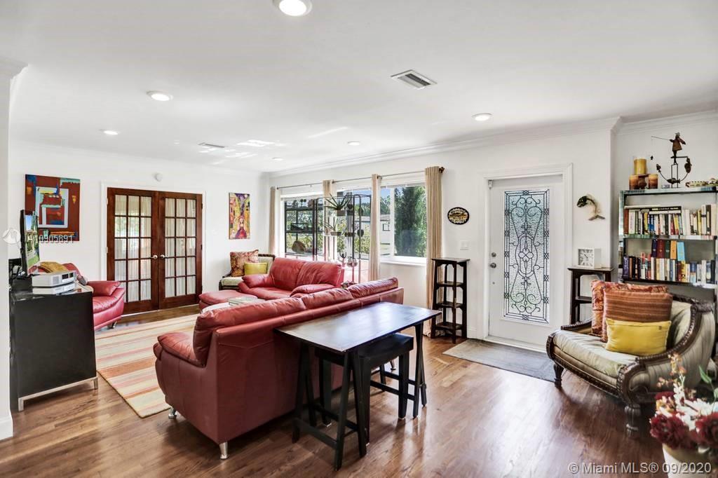 1301 South Biscayne Point Road Miami Beach, FL 33141 - Photo 4 of 45 a living room with furniture and a wooden floor