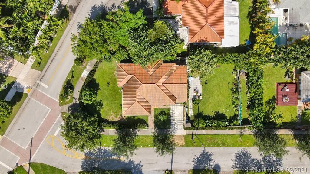 1301 South Biscayne Point Road Miami Beach, FL 33141 - Photo 41 of 45 an aerial view of a house with a garden and swimming pool