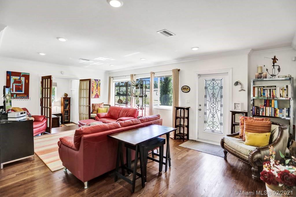 1301 South Biscayne Point Road Miami Beach, FL 33141 - Photo 6 of 45 a living room with furniture kitchen view and a wooden floor