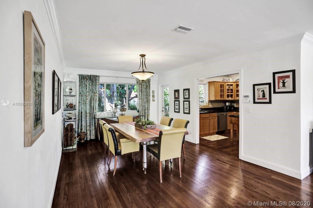 1301 South Biscayne Point Road Miami Beach, FL 33141 - Photo 10 of 45 a view of a dining room with furniture window and wooden floor